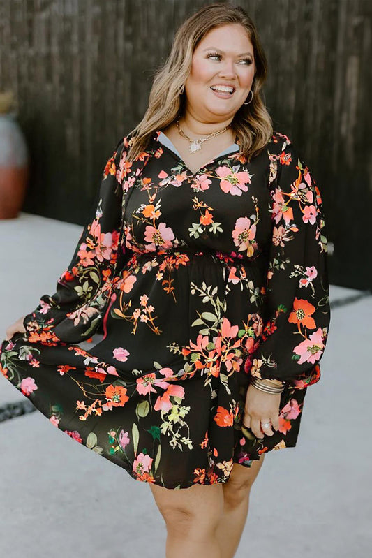 Woman wearing a black floral dress outdoors