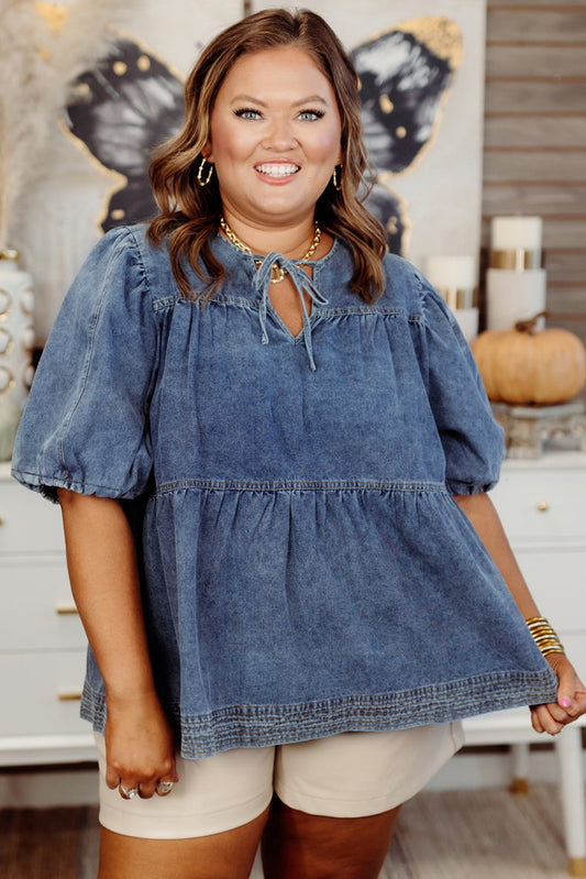 Woman wearing a blue denim top in a home setting