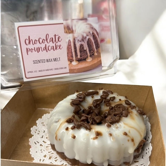 Chocolate Pound Cake wax melt, shaped like a bundt cake with white icing and chocolate shavings.