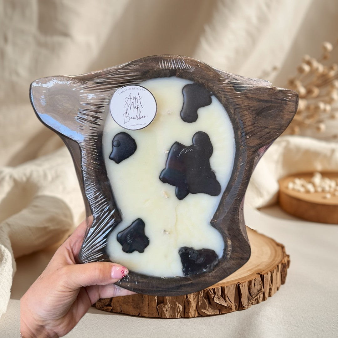 Apple Maple Bourbon large cow head dough bowl candle with black cow spots.