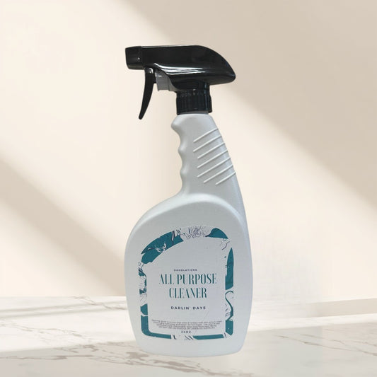 Doodlations All Purpose Cleaner in Darlin' Days scent, a white spray bottle with a teal floral label.