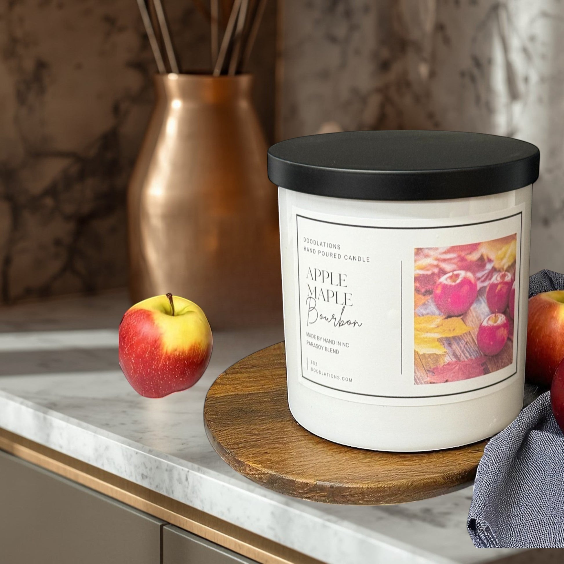 Doodlations Apples & Maple Bourbon candle, a para-soy blend with apple, cinnamon, bourbon, maple, and vanilla scents.