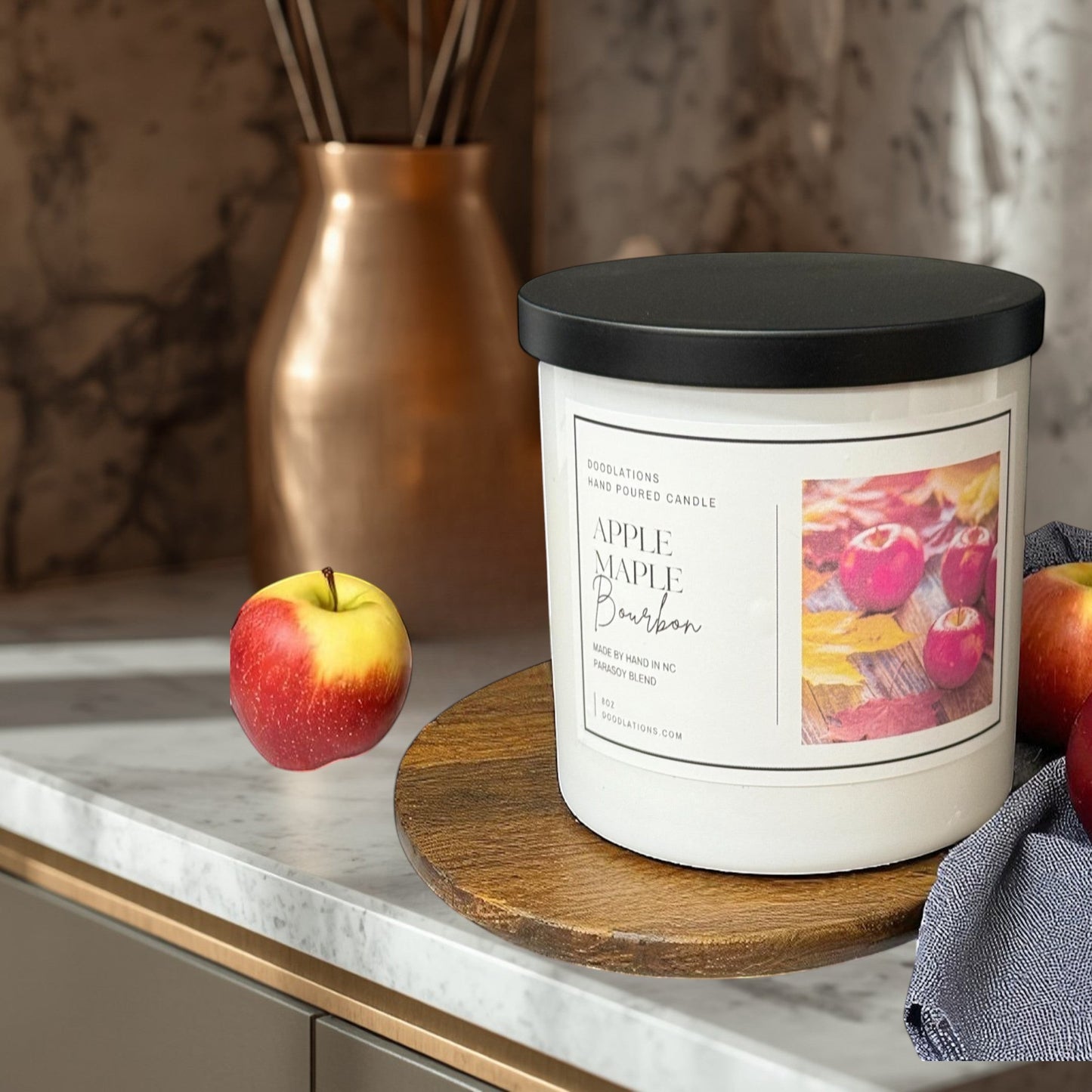 Doodlations Apples & Maple Bourbon candle, a para-soy blend with apple, cinnamon, bourbon, maple, and vanilla scents.