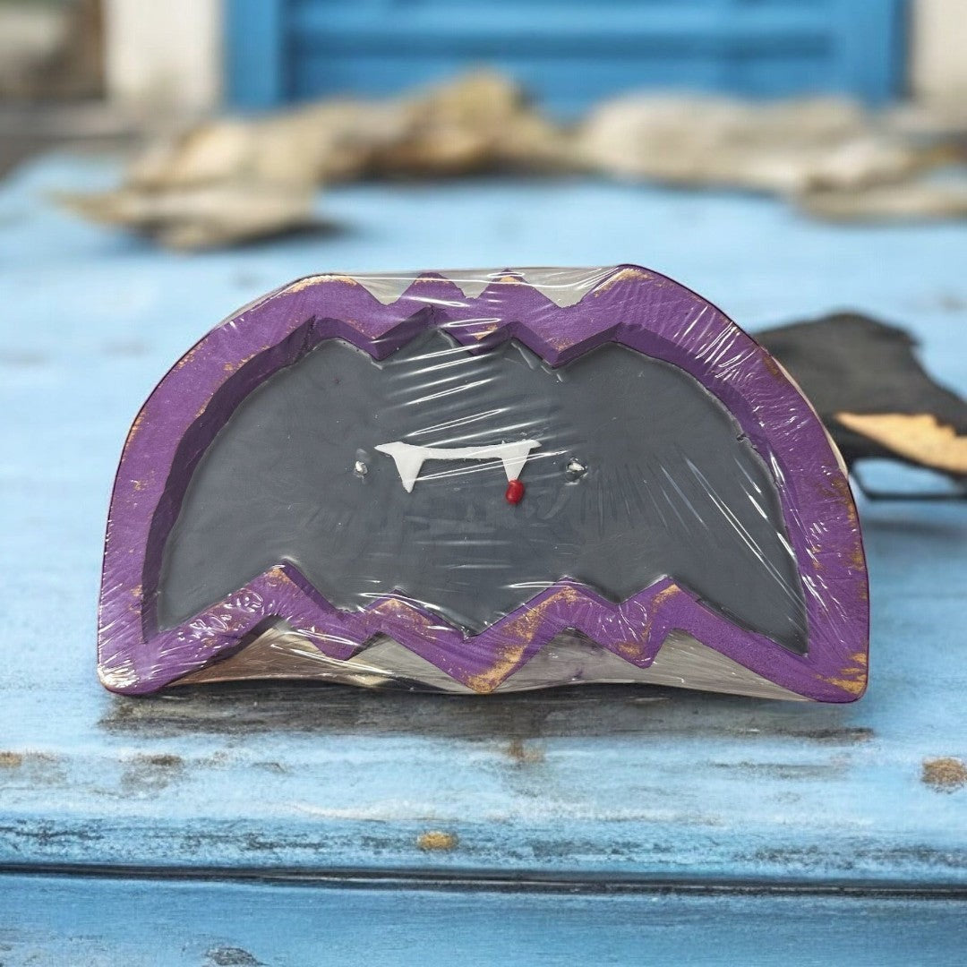 Doodlations Vampire Blood Bat wooden dough bowl candle with fangs and a drop of blood.