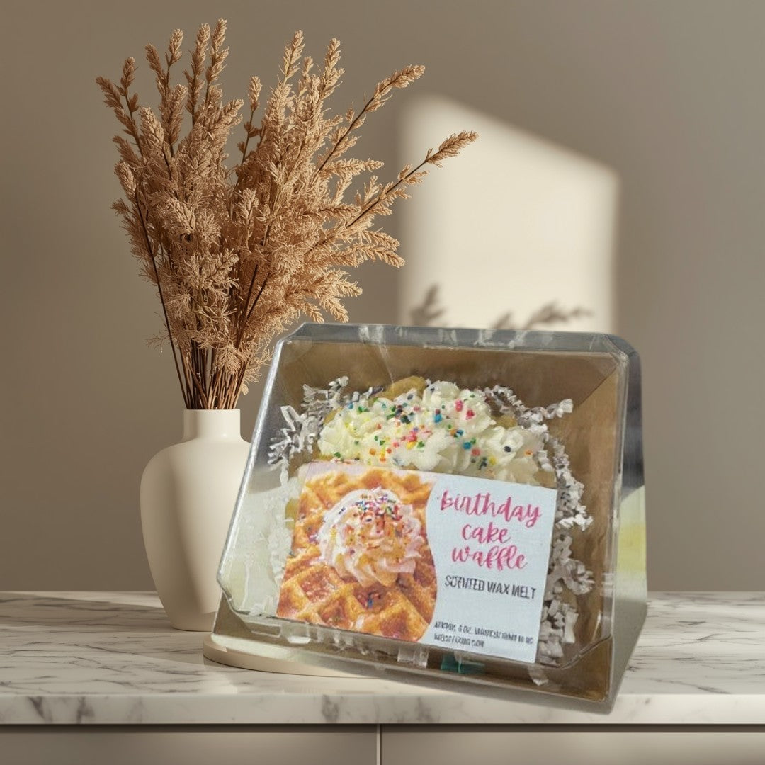 Doodlations Coffee Bar & Boutique birthday cake waffle scented wax melt topped with whipped cream and sprinkles.