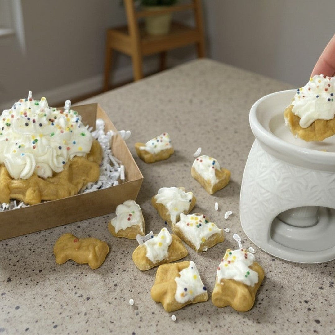 Doodlations Coffee Bar & Boutique Birthday Cake wax melt shaped like a waffle with whipped cream and sprinkles.