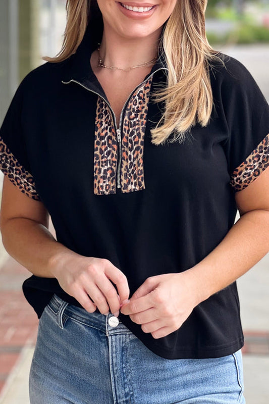 Doodlations Coffee Bar & Boutique black plus size top with leopard print half zip and short sleeves.