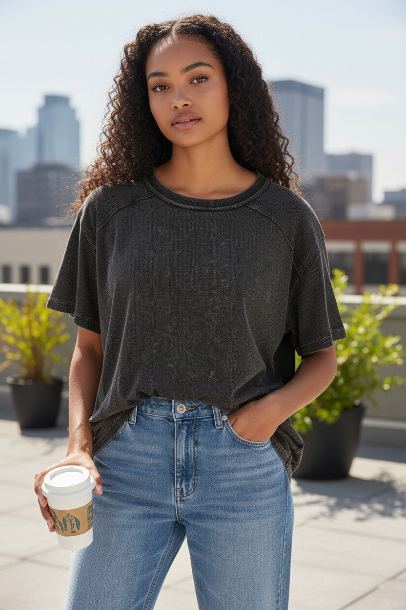 Doodlations Coffee Bar & Boutique black mineral wash oversized tee with crew neck and short sleeves.