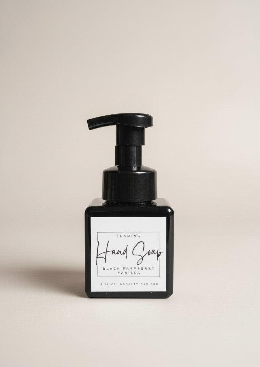 Doodlations black raspberry vanilla foaming hand soap in a square black bottle with a pump dispenser.