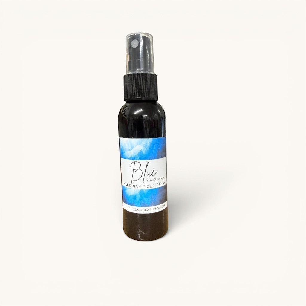 Doodlations Coffee Bar & Boutique Blue hand sanitizer spray bottle with black cap and blue abstract label.