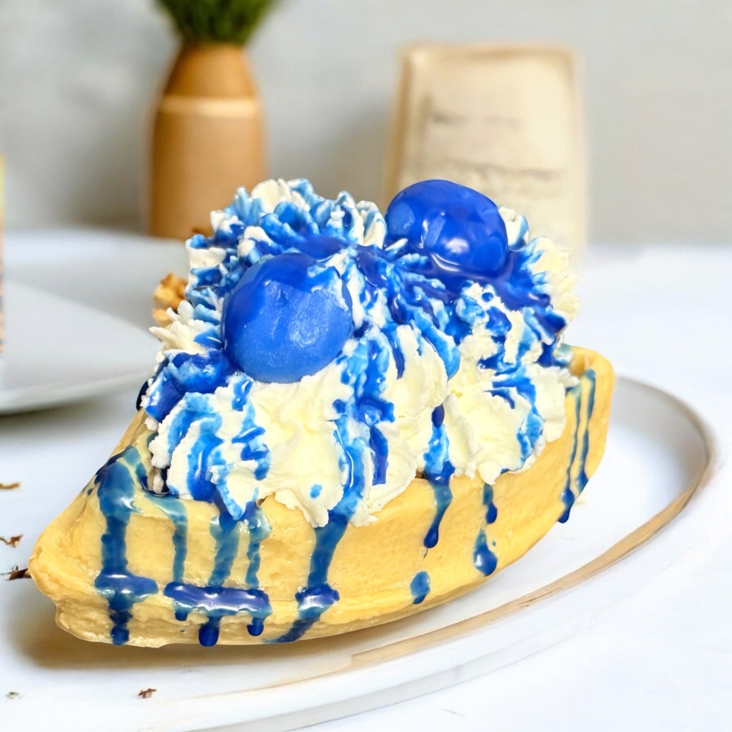 Doodlations Blueberry Waffle wax melts shaped like a waffle with whipped cream and blue syrup drizzle.