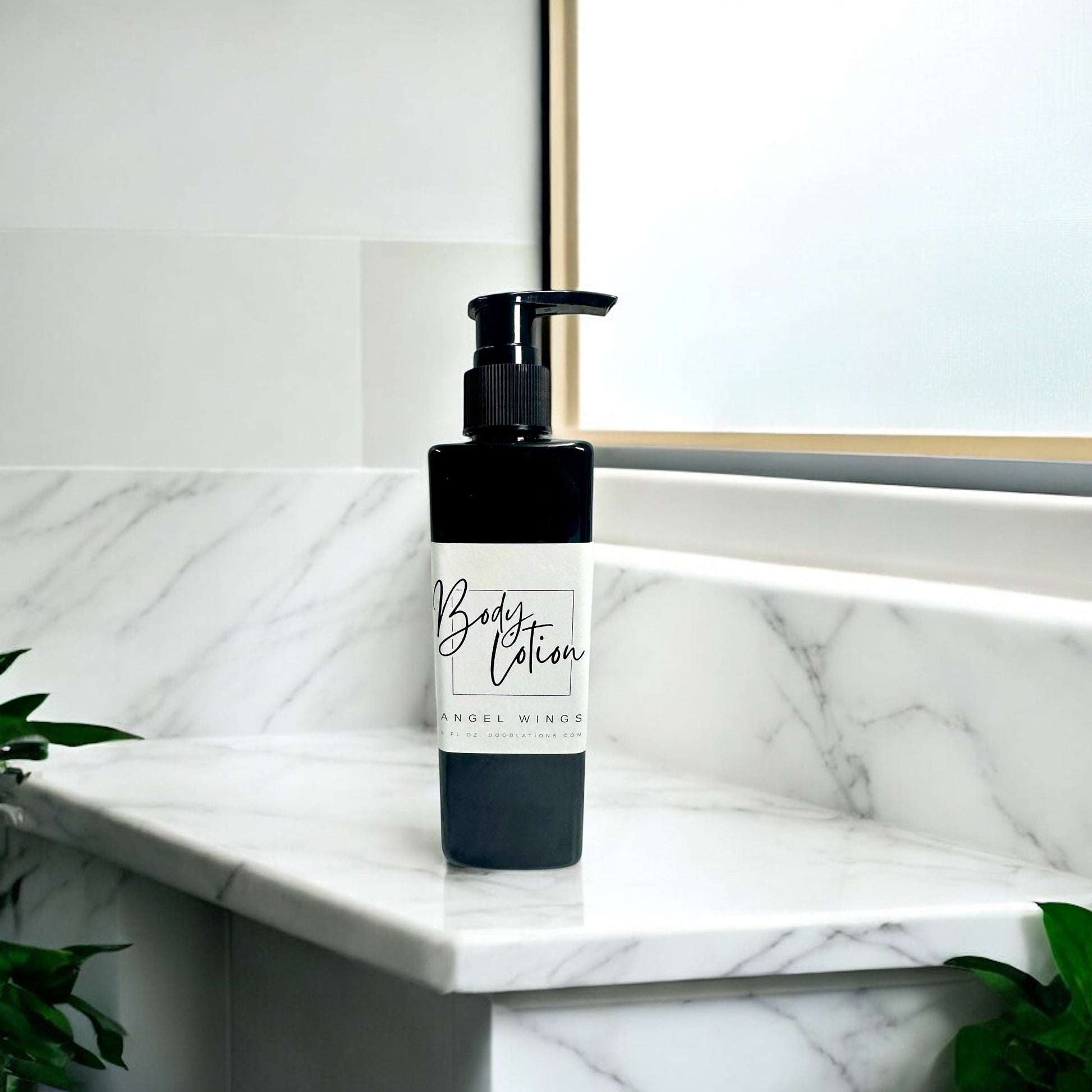 Doodlations Coffee Bar & Boutique black pump bottle of moisturizing body lotion with a white label.