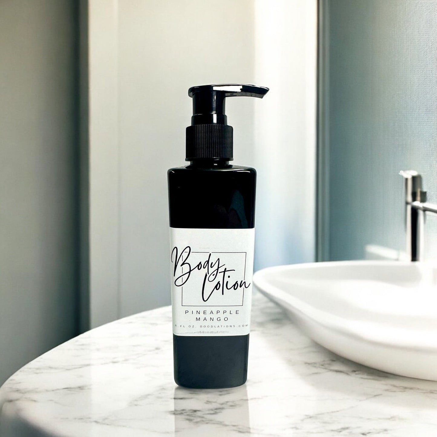 Doodlations Coffee Bar & Boutique black body lotion bottle with white label, pineapple mango scent, 8oz.