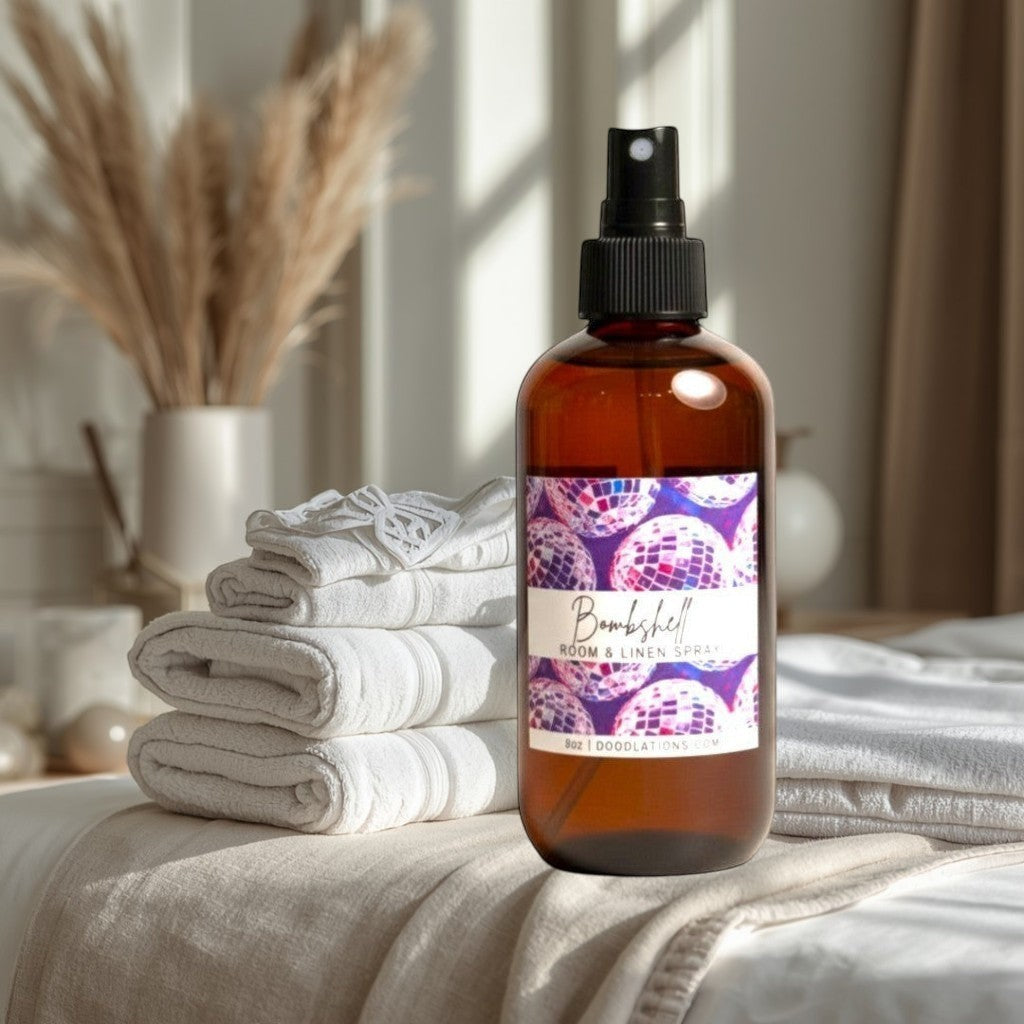 Doodlations Bombshell room and linen spray in amber glass bottle with disco ball label. Refresh home and linens.