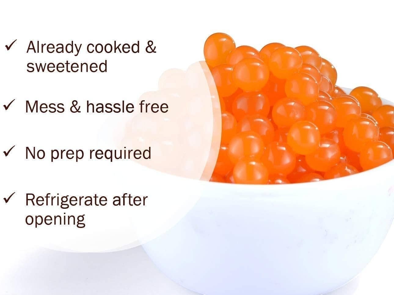 Doodlations Bursting Mango Balls, small translucent orange spheres filled with sweet mango liquid, perfect for drinks and desserts.
