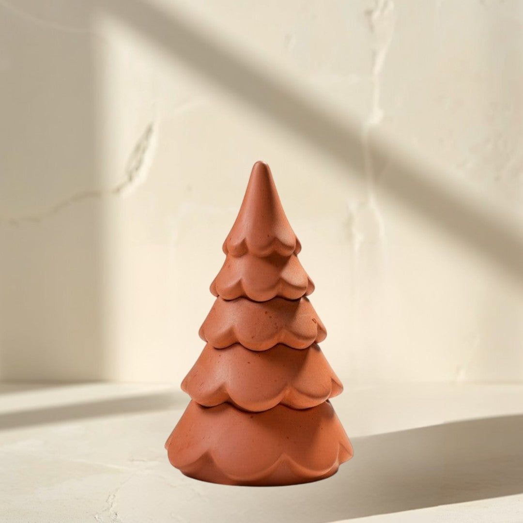 Doodlations 3-tier Christmas tree candle in terracotta concrete. Whimsical cloud design with festive charm.