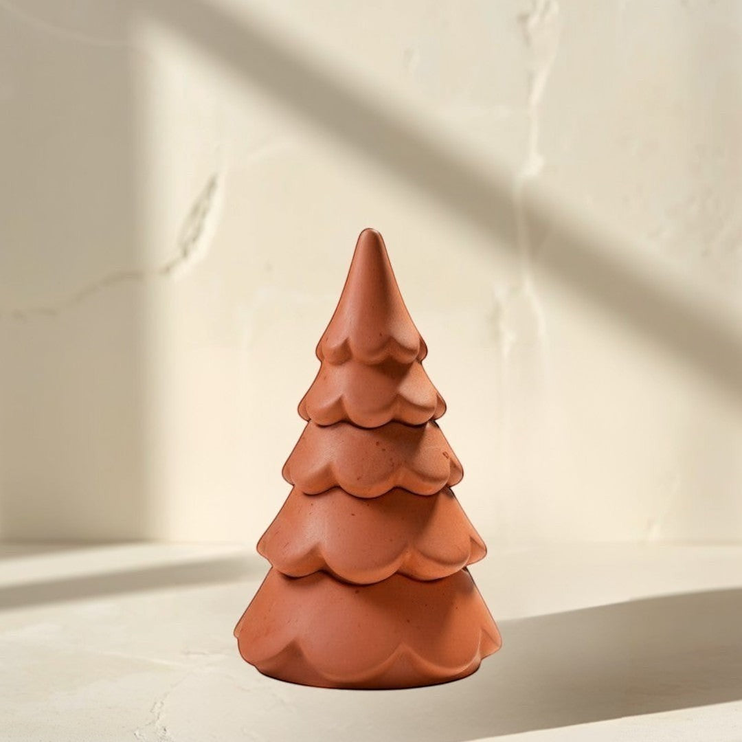 Doodlations 3-tier Christmas tree candle in terracotta concrete. Whimsical cloud design with festive charm.