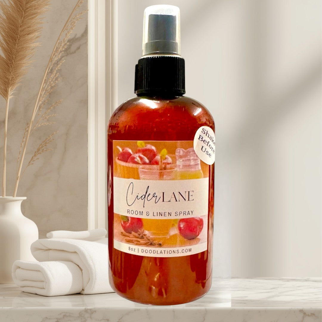 Doodlations Coffee Bar & Boutique Cider Lane 8oz room and linen spray with apple and cinnamon design.