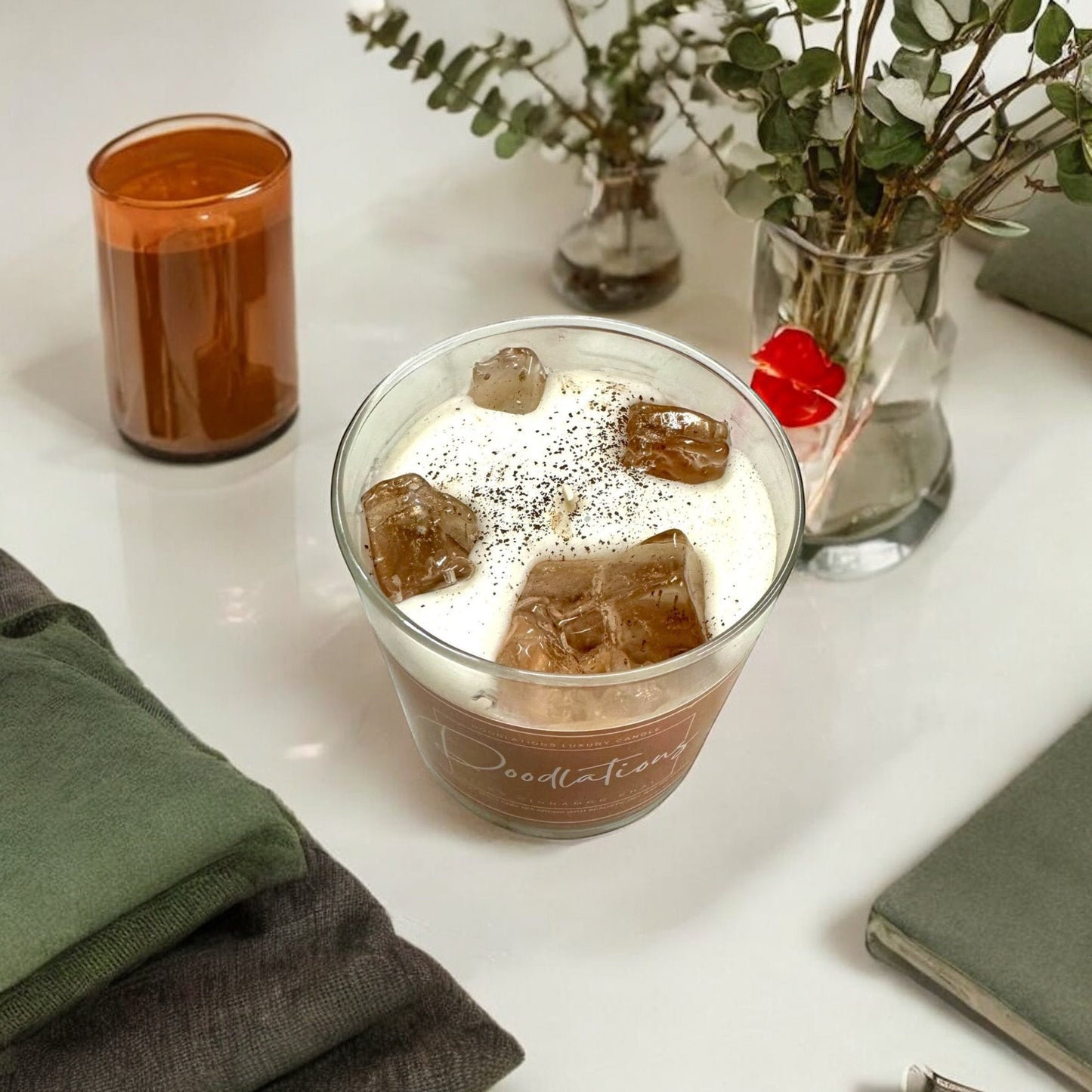 Doodlations Coffee Bar & Boutique Cinnamon Chai Latte Candle with realistic wax ice cubes and a single wick.