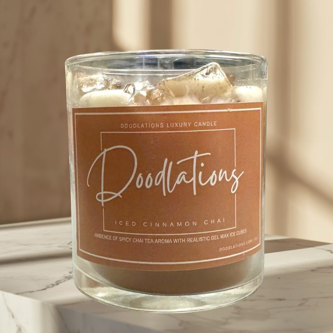 Doodlations Cinnamon Chai Latte Candle with realistic wax ice cubes and a single wick. Warm, spicy scent.