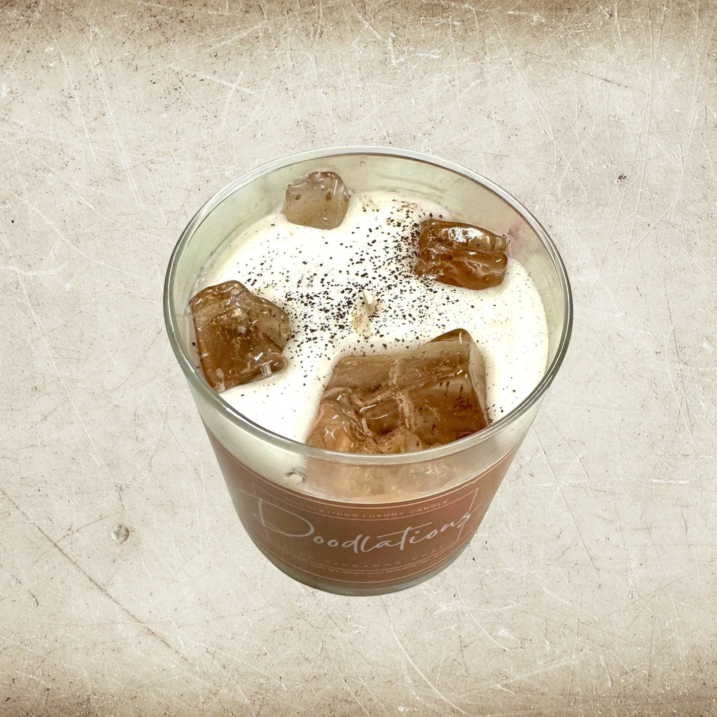 Doodlations Coffee Bar & Boutique Cinnamon Chai Latte Candle with realistic wax ice cubes and a single wick.