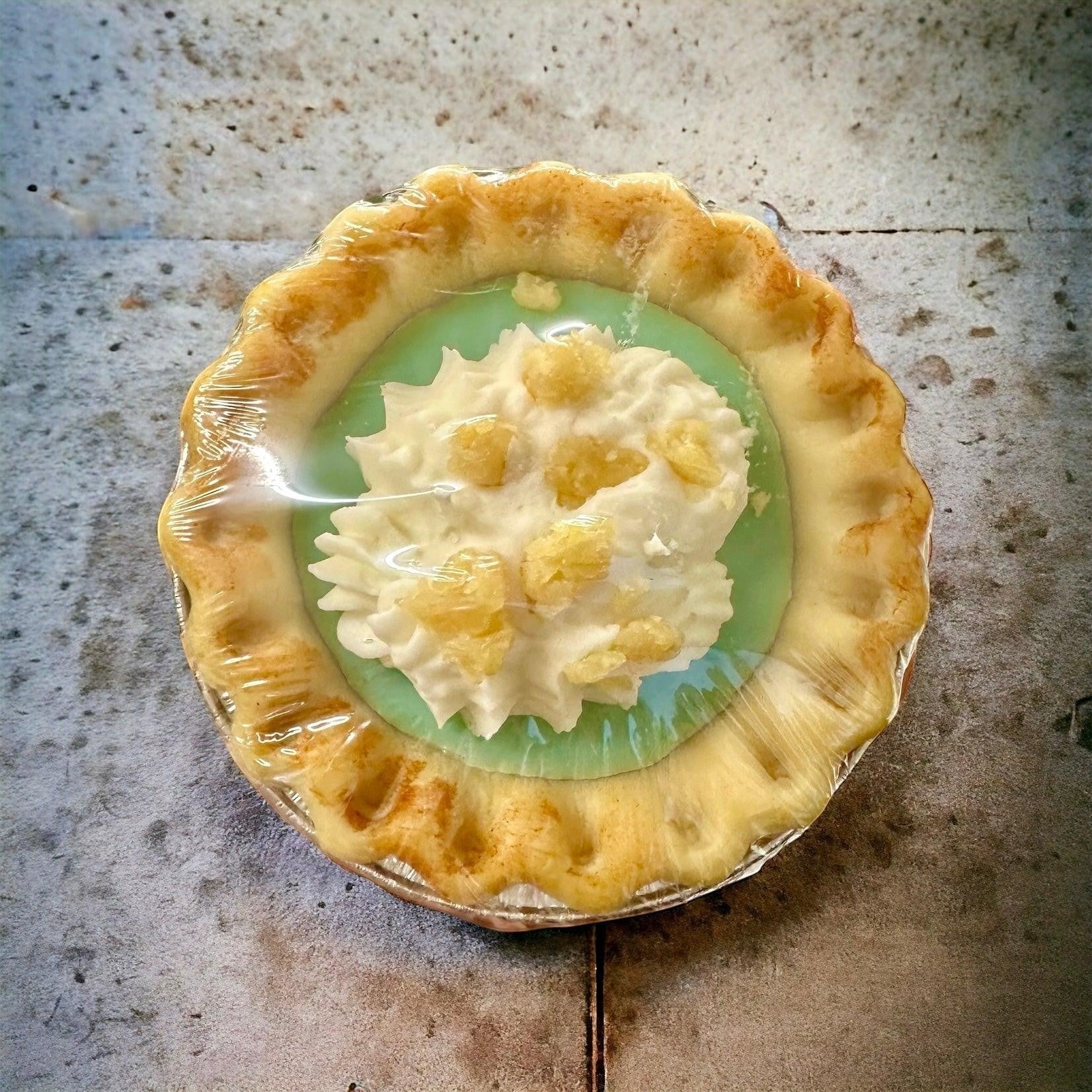 Doodlations Coffee Bar & Boutique individual creamy citrus tart with whipped cream and candied peel.