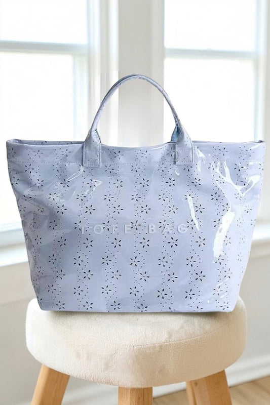 Doodlations Coffee Bar & Boutique baby blue PVC tote bag with a glossy finish and delicate floral eyelet pattern.
