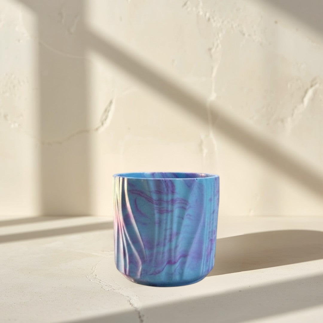 Doodlations Coffee Bar & Boutique Darlin’ Days marbled concrete candle in blue and purple hues. Soy blend wax.