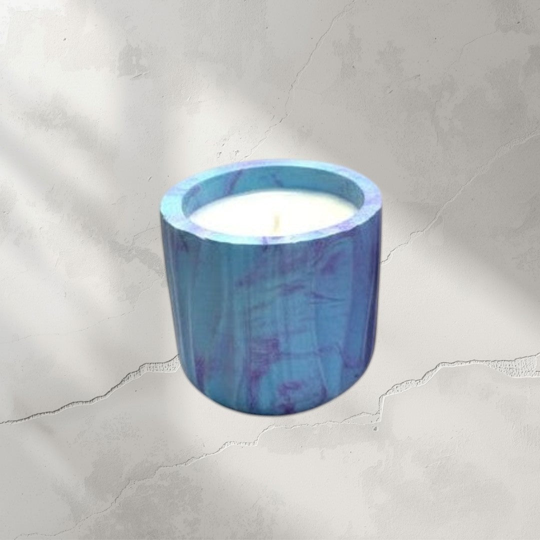 Doodlations Coffee Bar & Boutique marbled concrete candles in blue and pink, hand-poured soy wax.