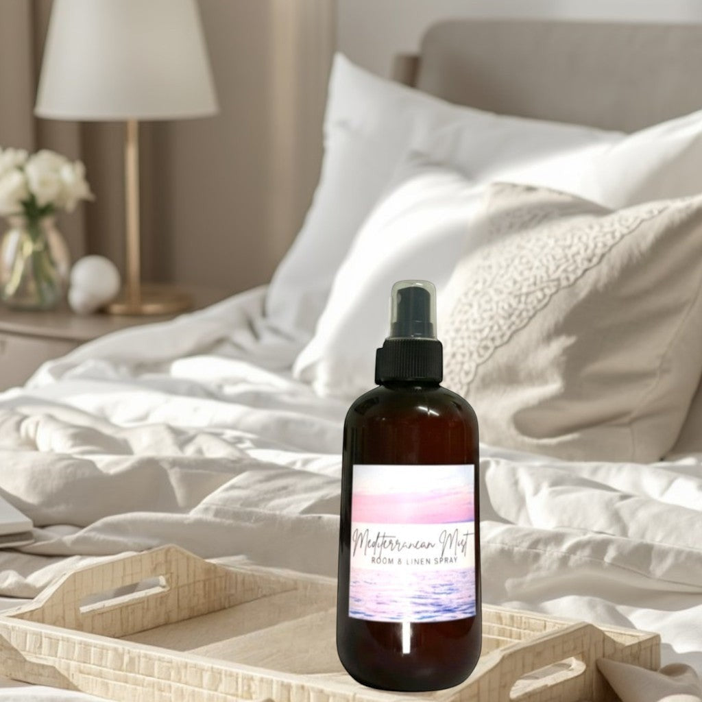 Doodlations Coffee Bar & Boutique Mediterranean Mist room and linen spray in amber bottle with ocean sunset label.