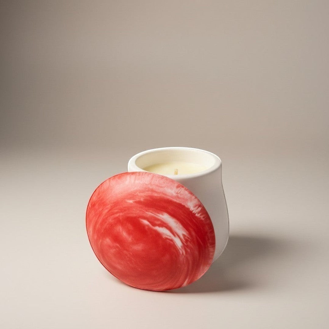 Doodlations Coffee Bar & Boutique mushroom concrete candle with a red and white marbled lid and salted honey scent.