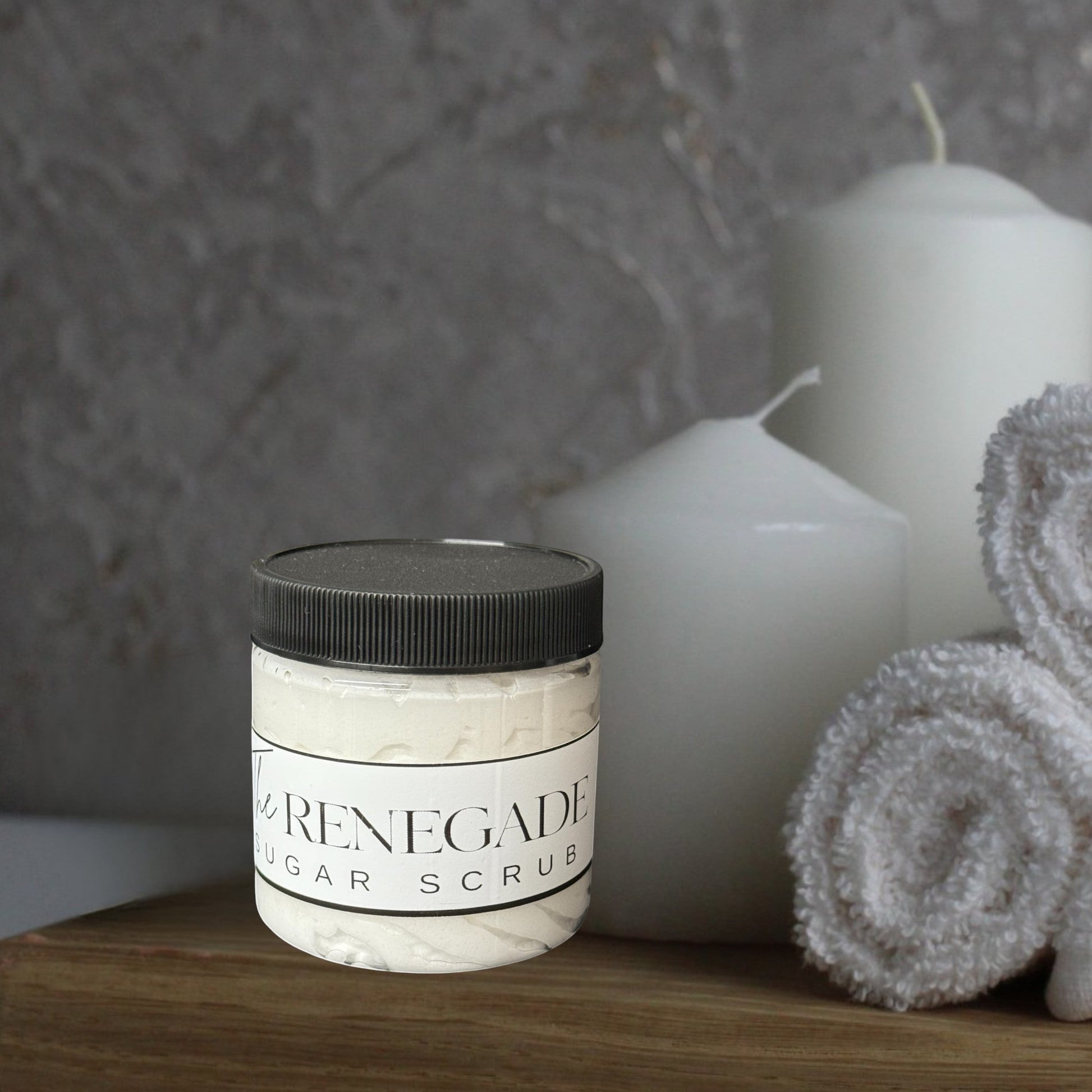 Doodlations Coffee Bar & Boutique The Renegade Men's Sugar Scrub in a clear jar with a black lid.