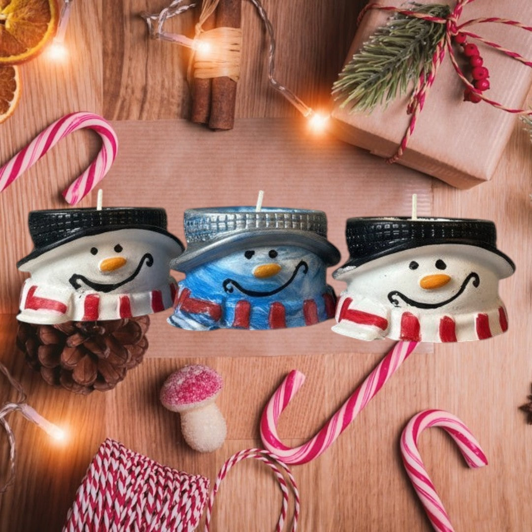 Doodlations Coffee Bar & Boutique snowman concrete tea light holders with red striped scarves and blue scarves.