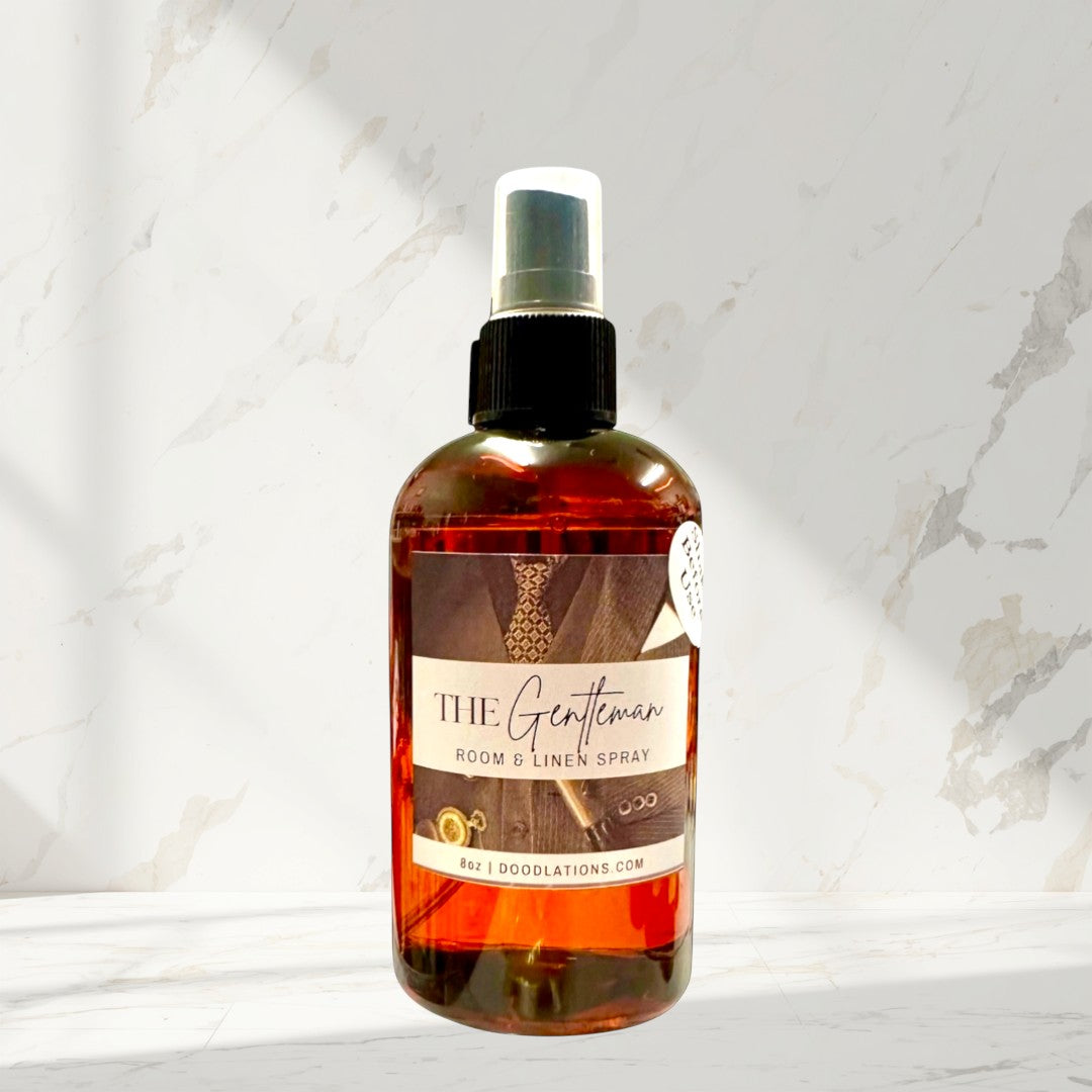 Doodlations Coffee Bar & Boutique The Gentleman Room & Linen Spray with mahogany, blood orange, and bourbon vanilla scent.