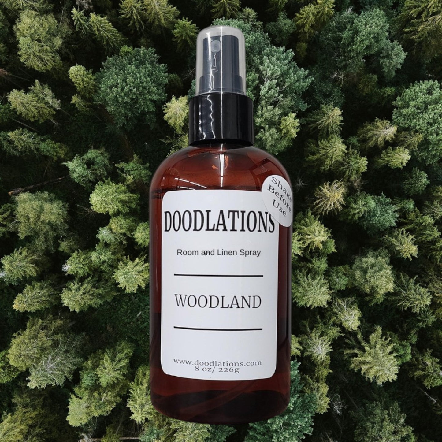Doodlations Coffee Bar & Boutique Woodland room and linen spray in amber bottle with white label. 8 oz.