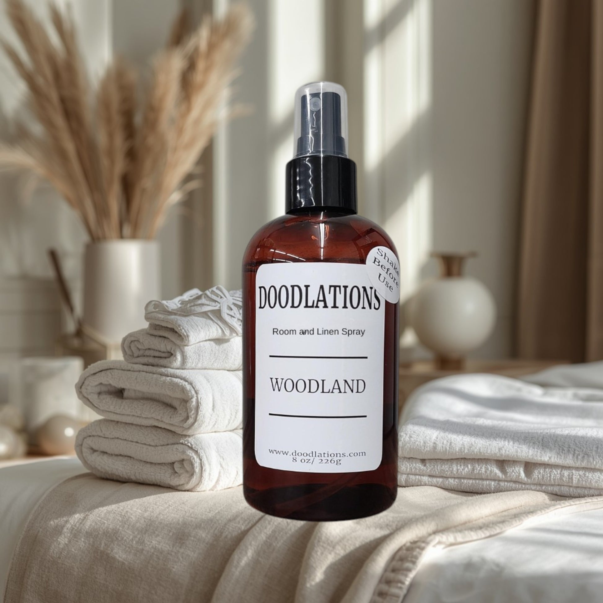 Doodlations Coffee Bar & Boutique Woodland room and linen spray in amber bottle with white label, 8 oz.