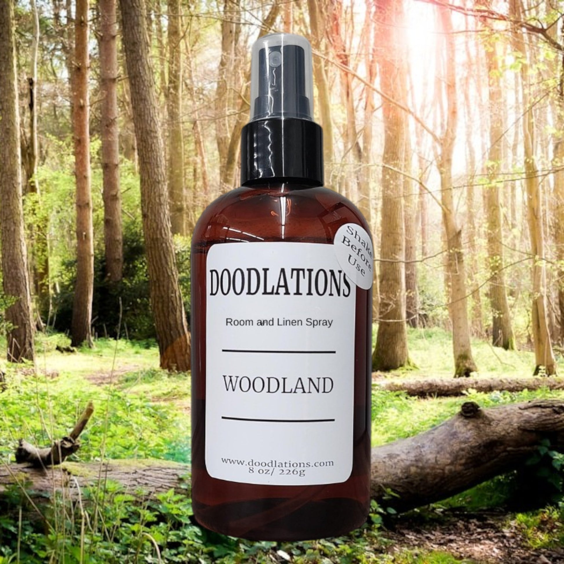 Doodlations Coffee Bar & Boutique Woodland room and linen spray in amber bottle with white label. Cozy home fragrance.