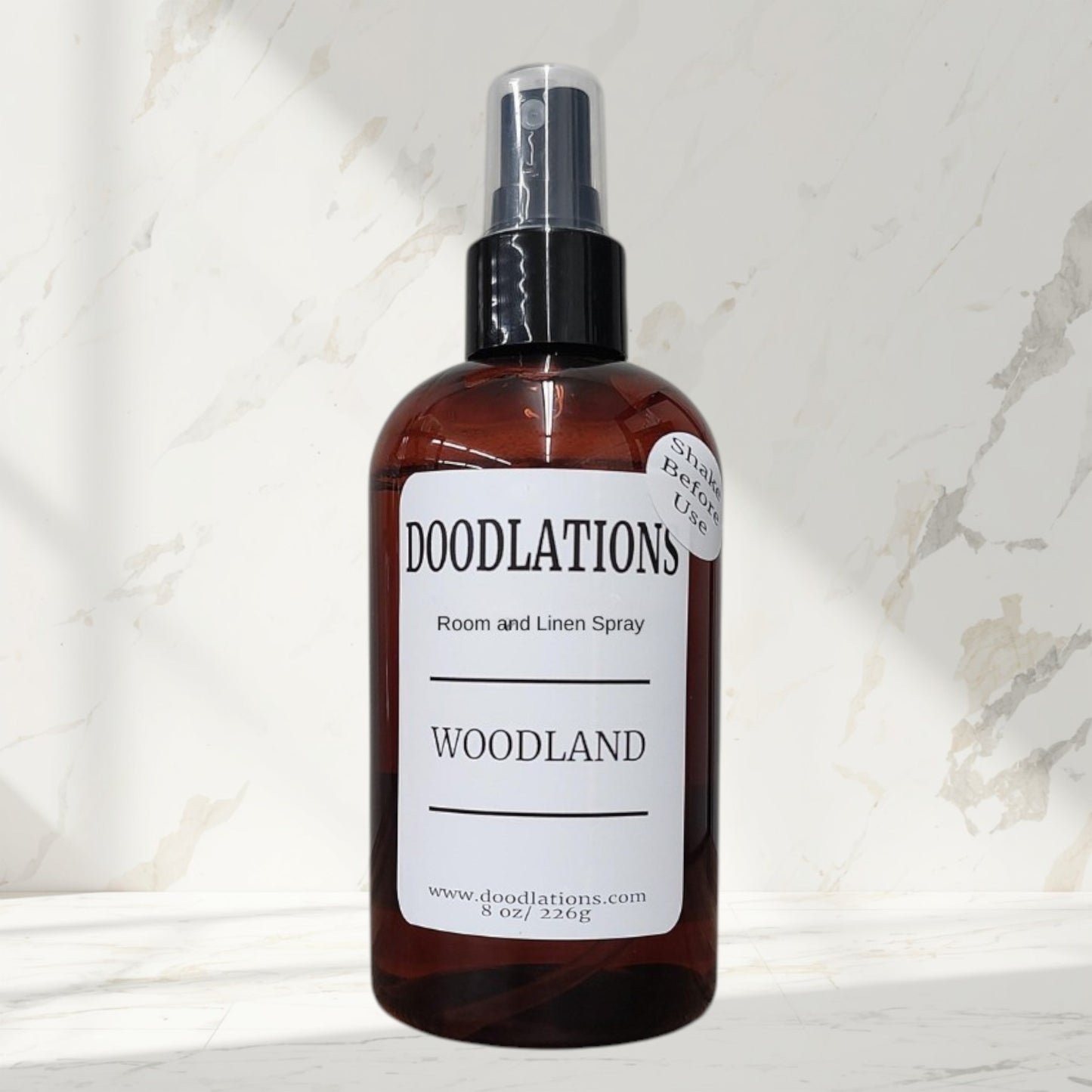 Doodlations Coffee Bar & Boutique Woodland room and linen spray in amber bottle with white label. 8 oz.