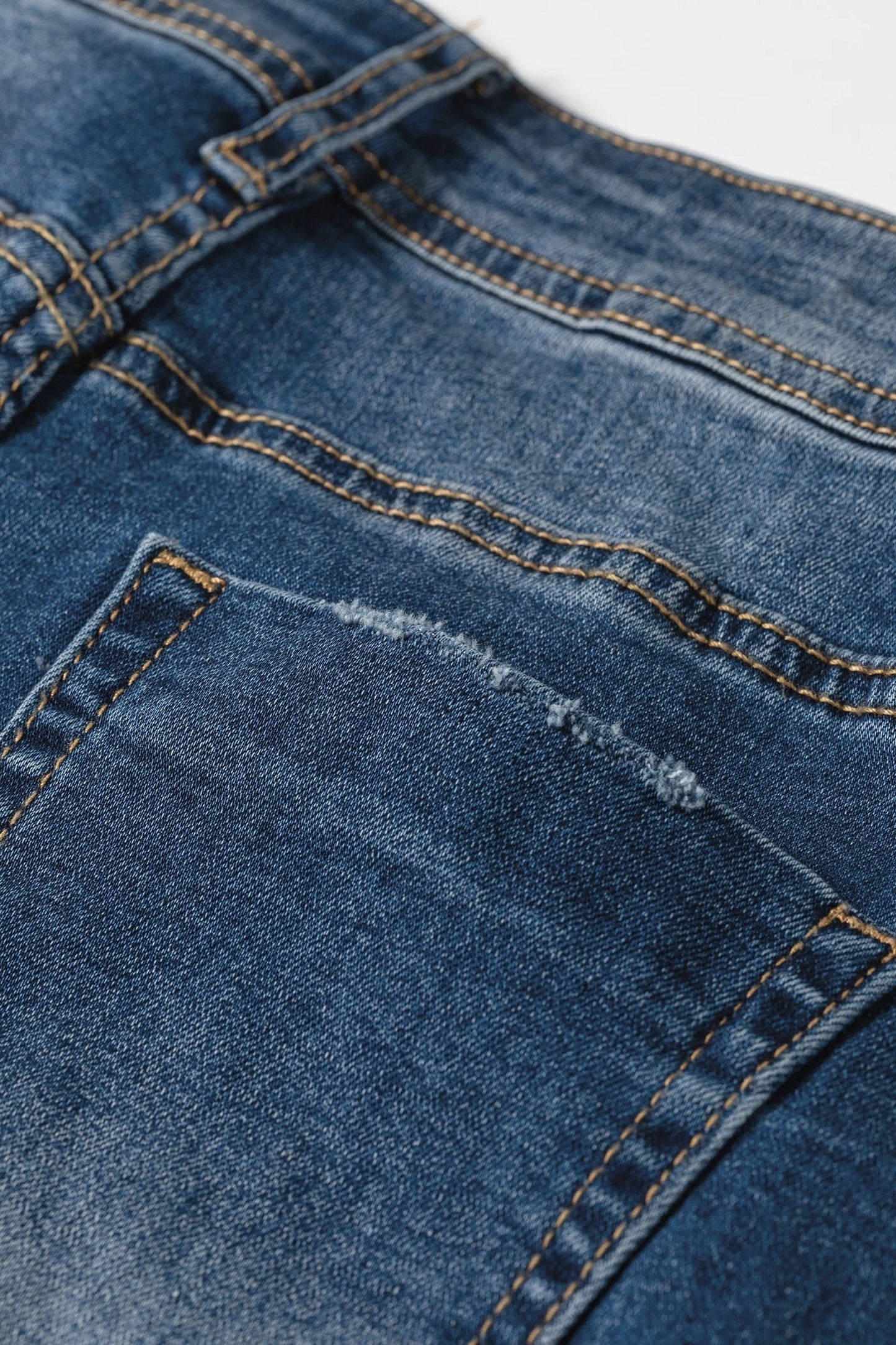 Doodlations Coffee Bar & Boutique blue acid washed denim jeans with distressed pocket detail and contrast stitching