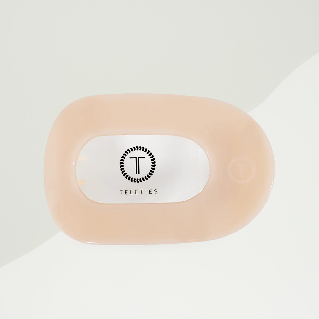 Doodlations Coffee Bar & Boutique almond beige Teleties flat round hair clip with a durable, comfortable design.