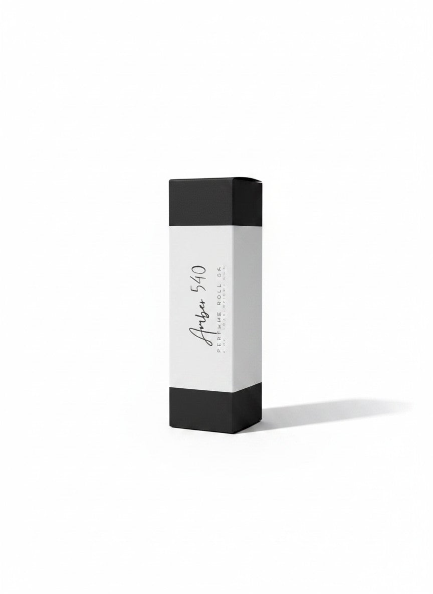 Doodlations Coffee Bar & Boutique Amber 540 luxury roll-on perfume in a sleek black and white rectangular box.