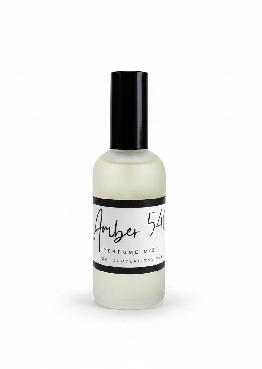 Doodlations Coffee Bar & Boutique Amber 540 fine mist perfume in a sleek frosted glass bottle with a black cap.