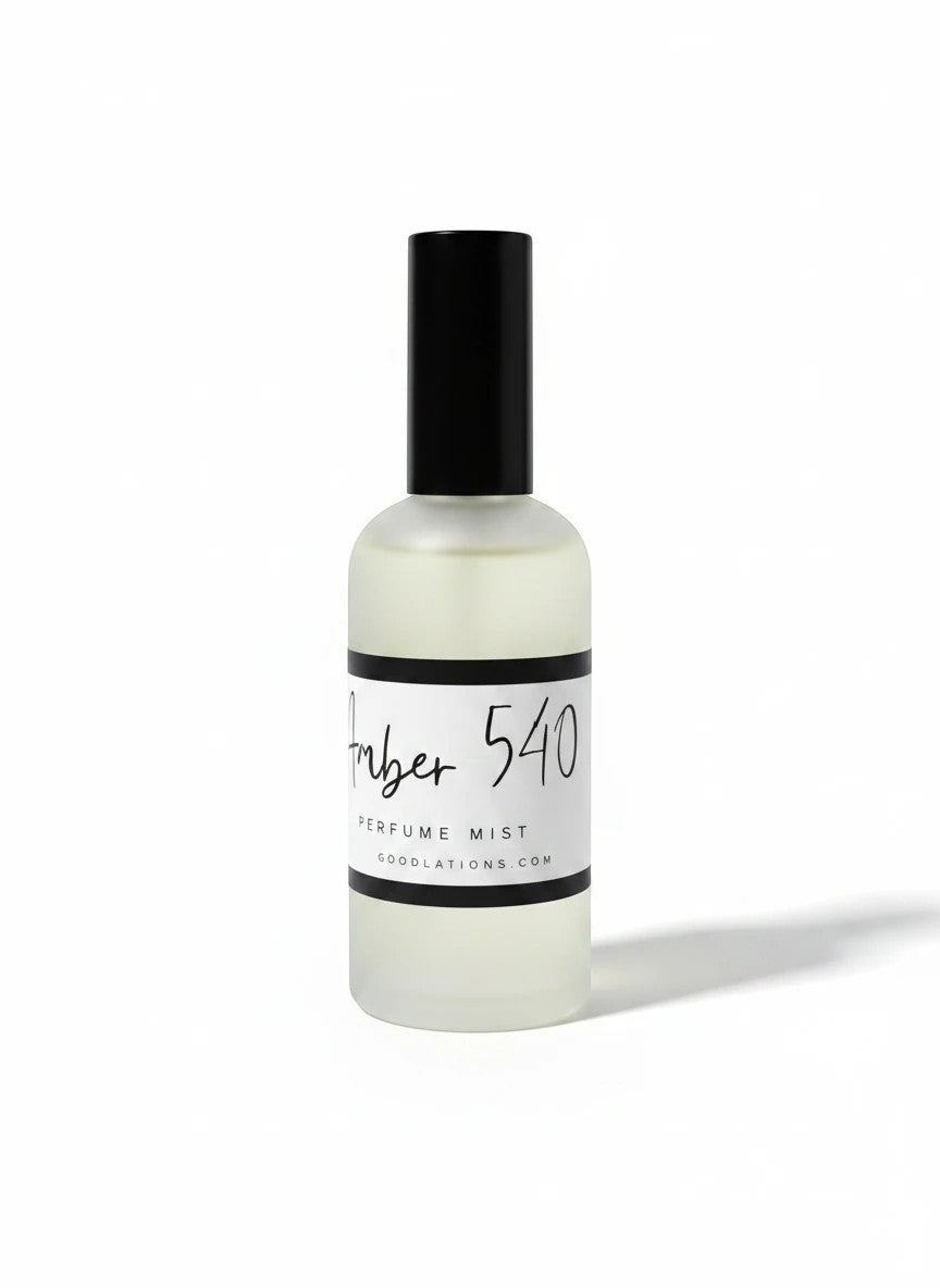Doodlations Coffee Bar & Boutique Amber 540 fine mist perfume in a sleek frosted glass bottle with a black cap.