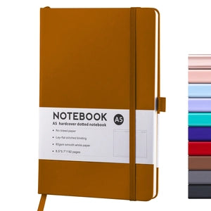 Doodlations Coffee Bar & Boutique A5 hardcover dotted journal in mustard yellow with elastic closure and pen loop.