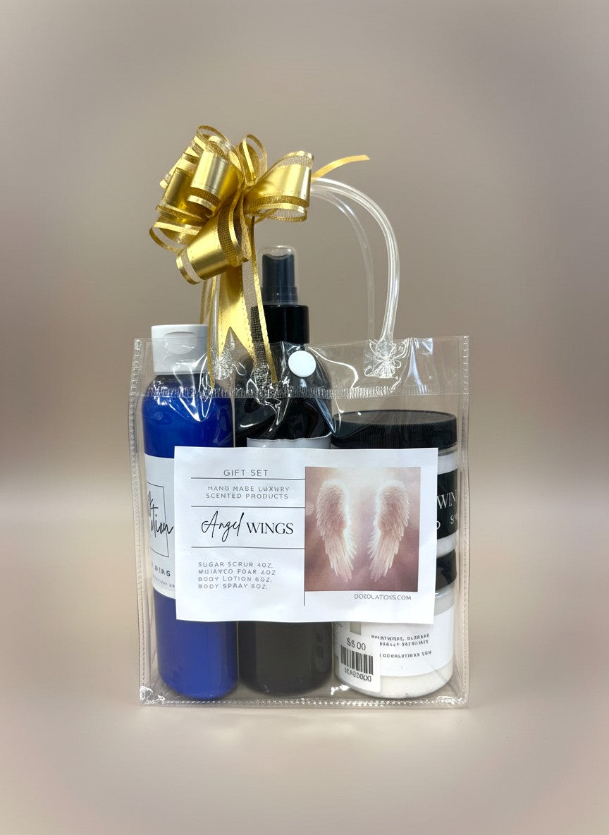 Doodlations Coffee Bar & Boutique Angel Wings gift set with sugar scrub, whipped soap, body lotion, and body spray in a clear bag with a gold bow.