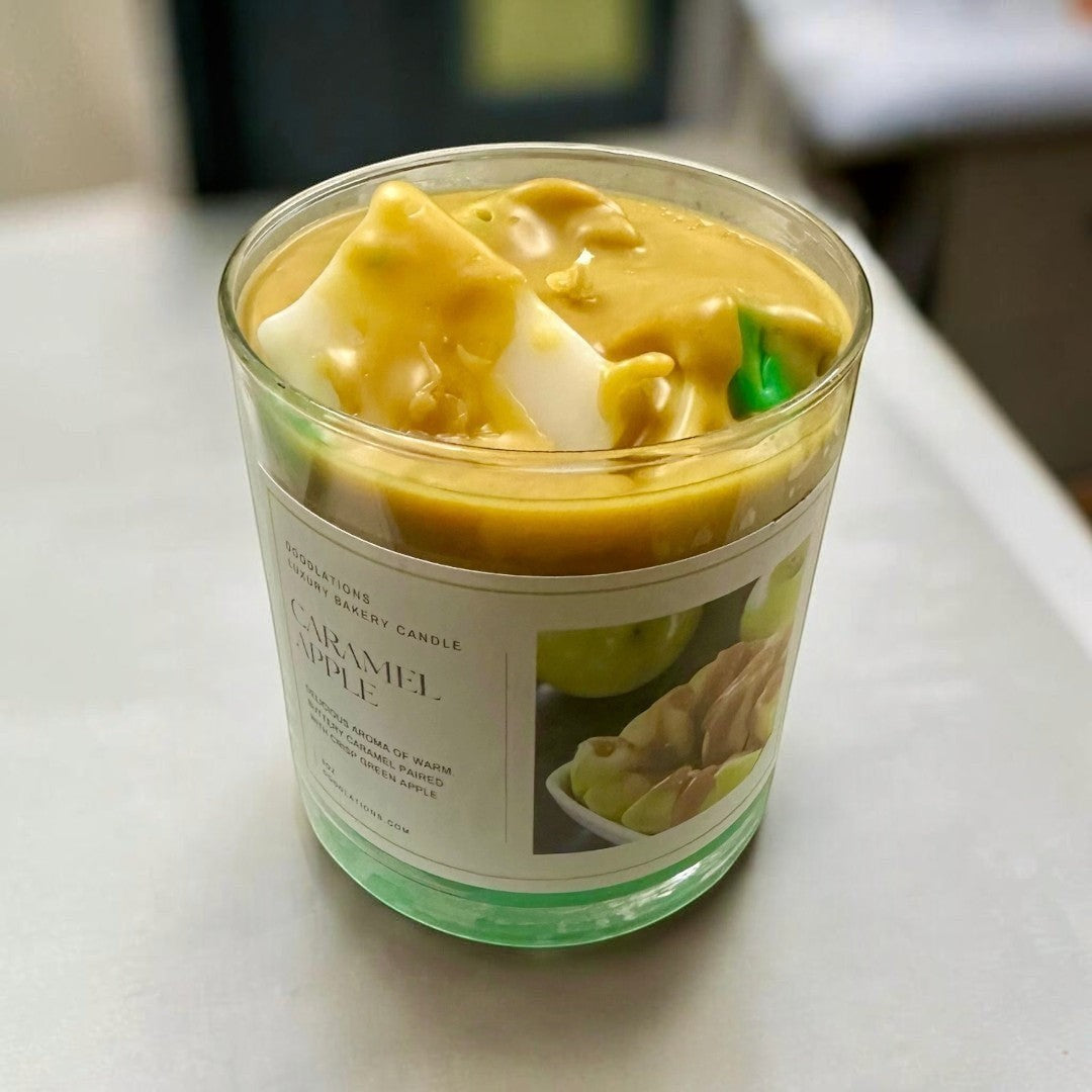 Doodlations Coffee Bar & Boutique Apple Caramel Candle with wax apples on top, 8oz glass jar.