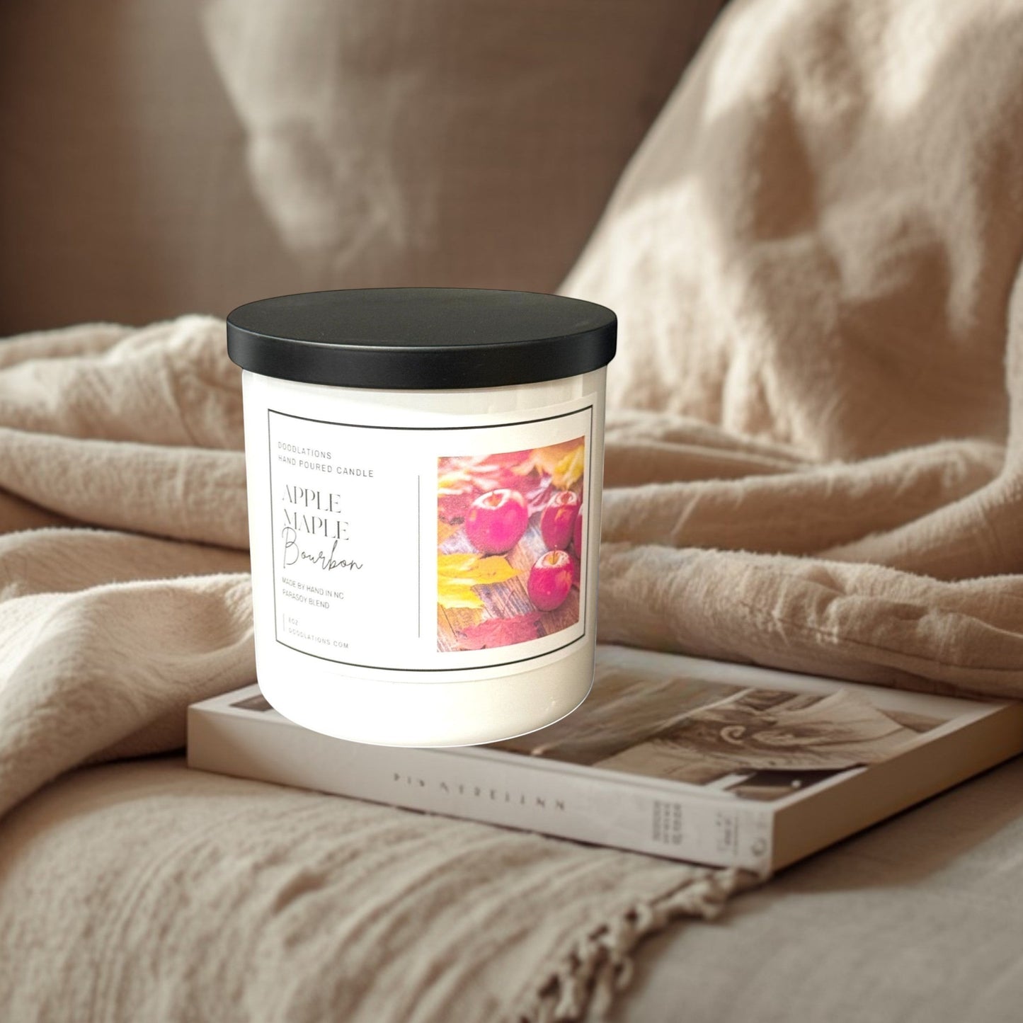 Doodlations Coffee Bar & Boutique Apple & Maple Bourbon hand-poured para-soy blend candle with autumn leaves and apples on label.