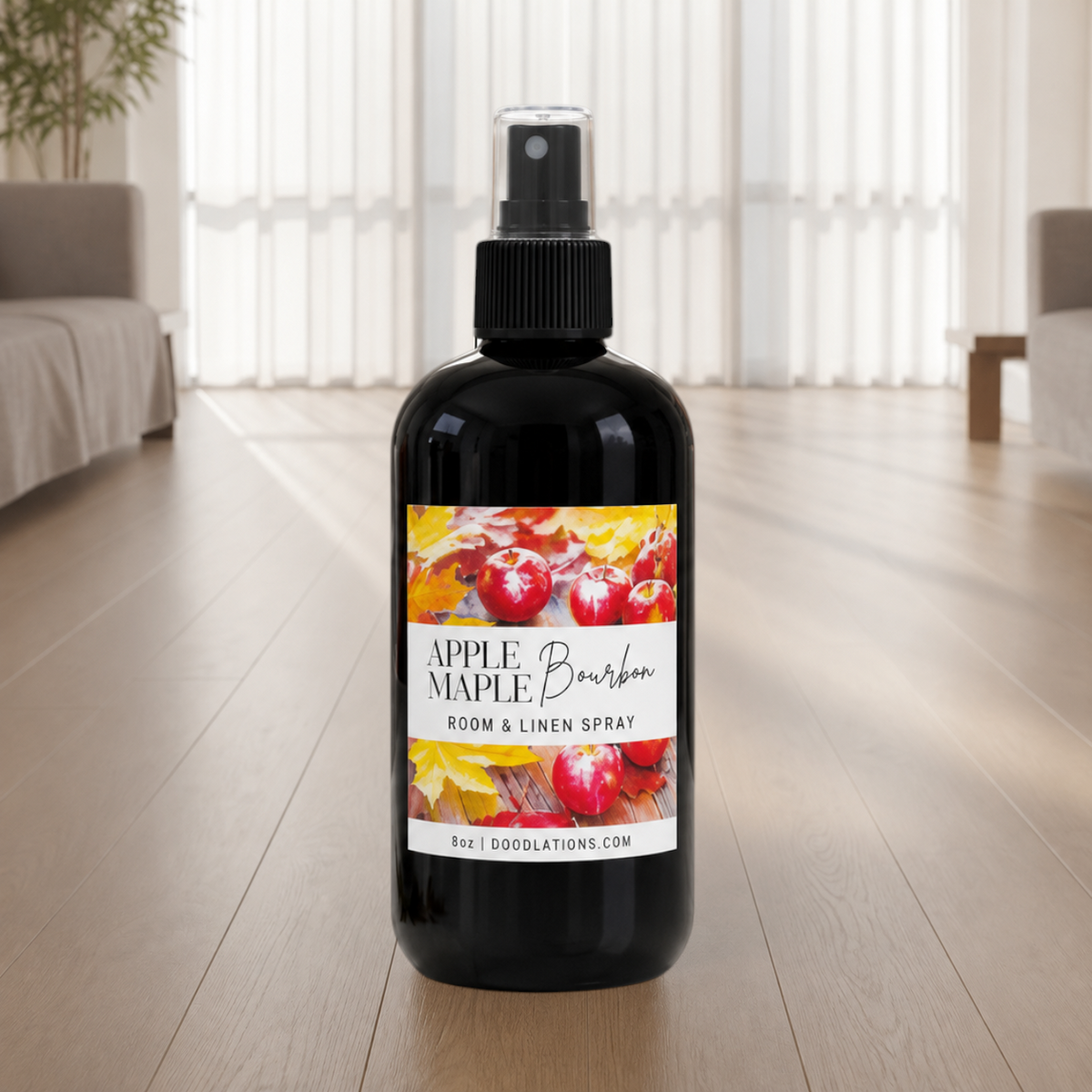 Doodlations Coffee Bar & Boutique Apple & Maple Bourbon room and linen spray in a black bottle with autumn label.