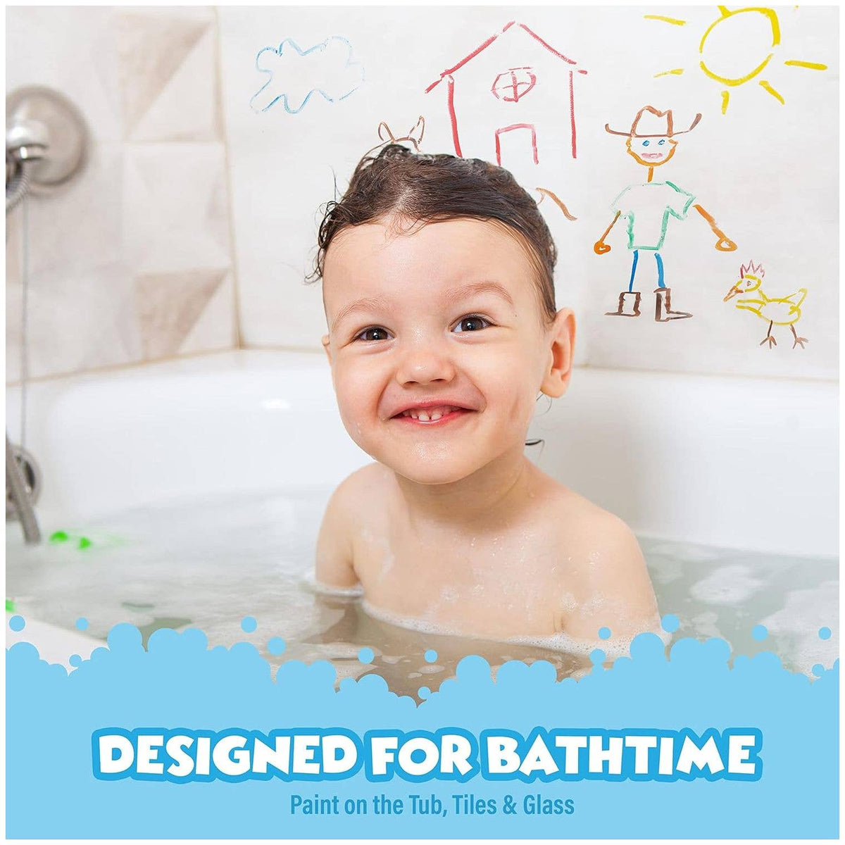 A happy toddler drawing on white bathtub walls with Doodlations Coffee Bar & Boutique non-toxic bath paint sticks.