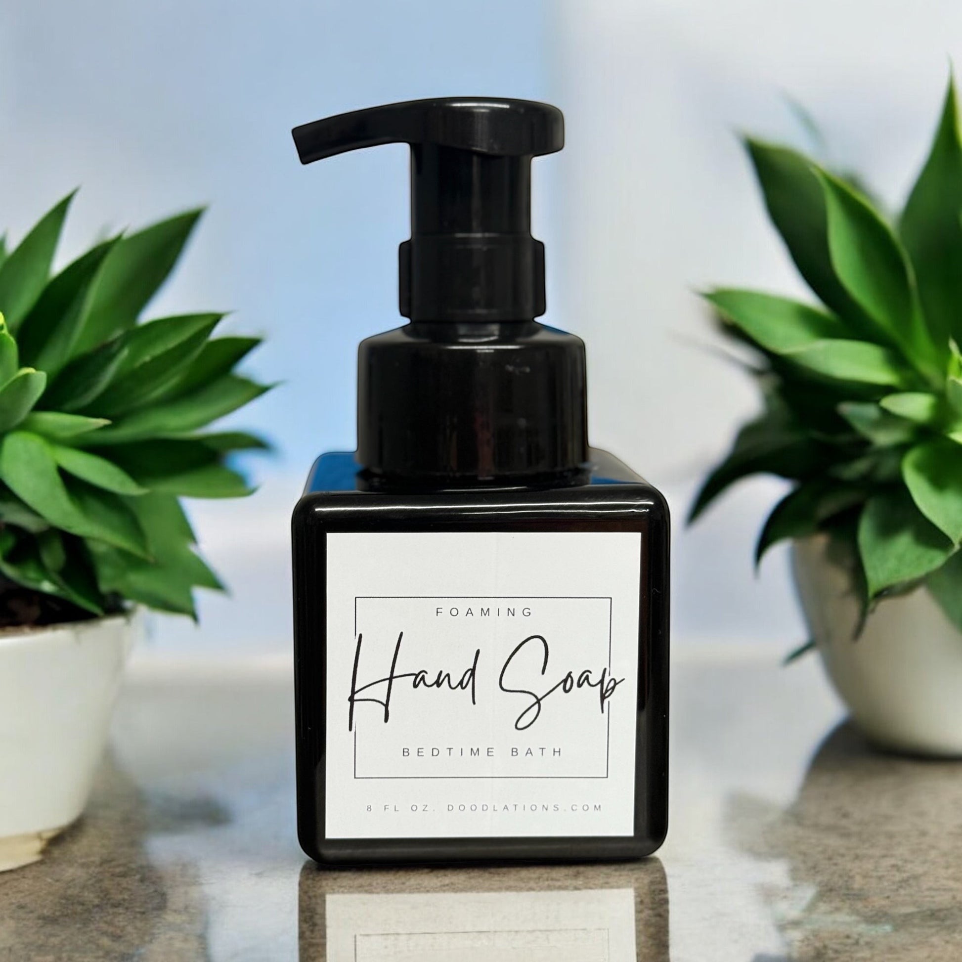 Doodlations Coffee Bar & Boutique Bedtime Bath foaming hand soap in a black square bottle with a white label.